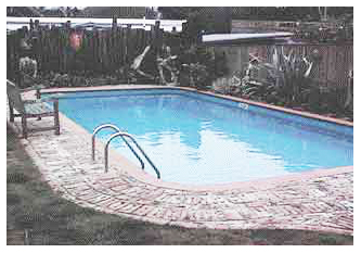 NICE OLD-STYLE LANDSCAPING AROUND MEDIUM SIZE POOL